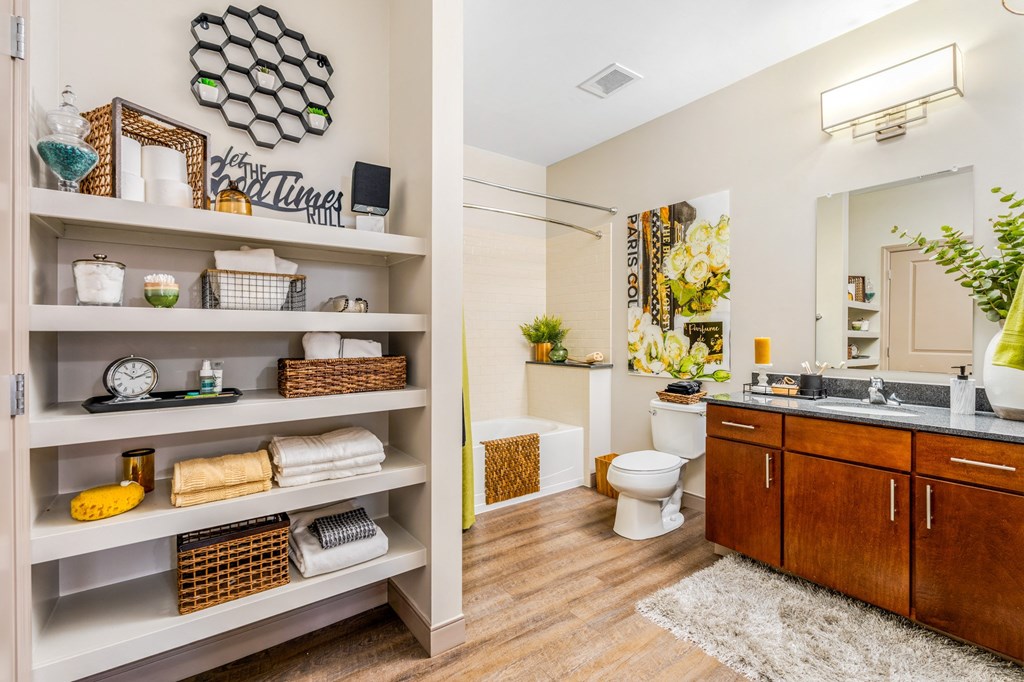 a bathroom with a sink toilet and a mirror