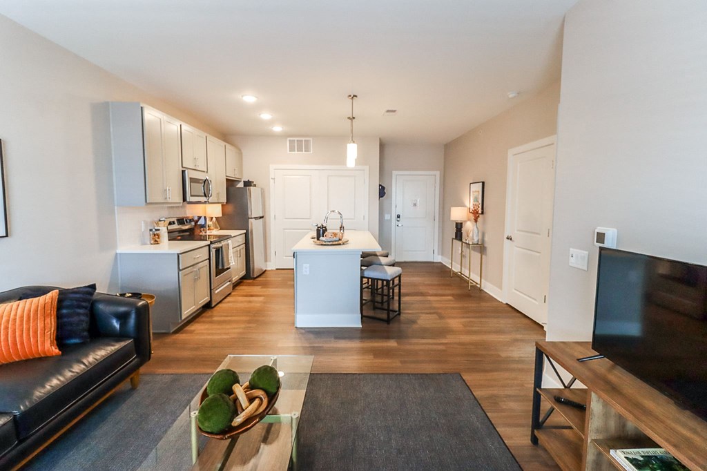 a living room with a couch a table and a television
