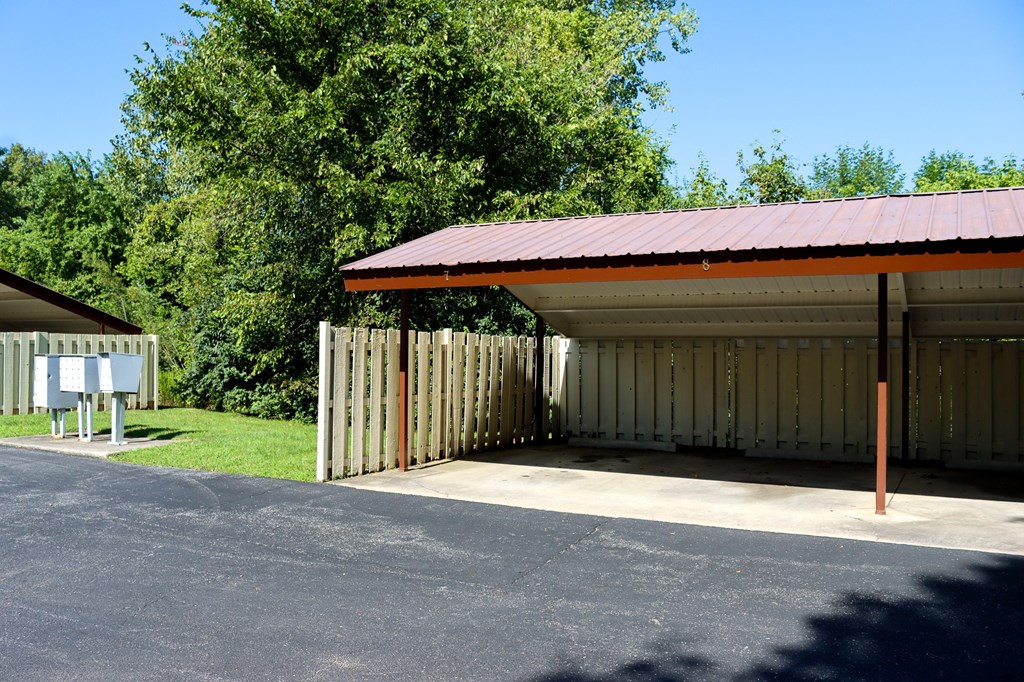 a covered parking garage with a red roof