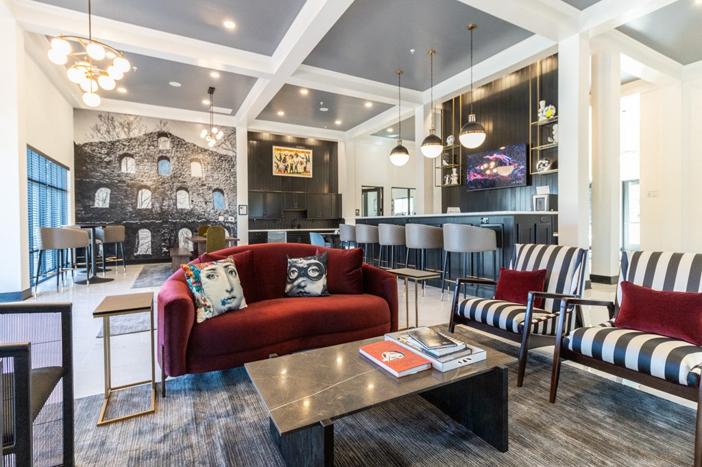 a living room with couches and chairs and a table