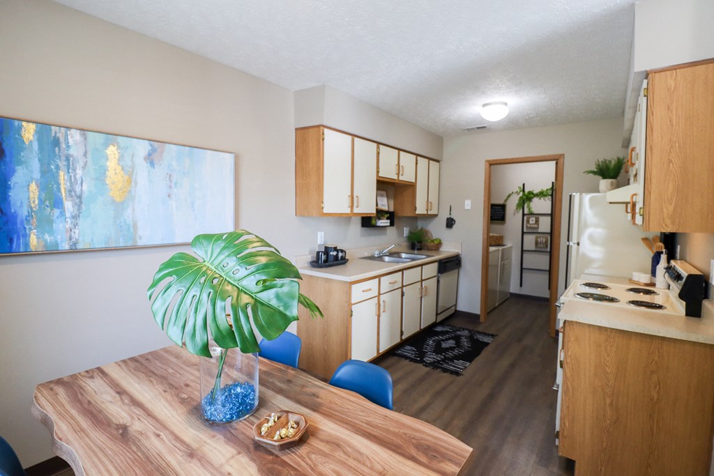 the view of a kitchen and dining room from the living room of an apartment