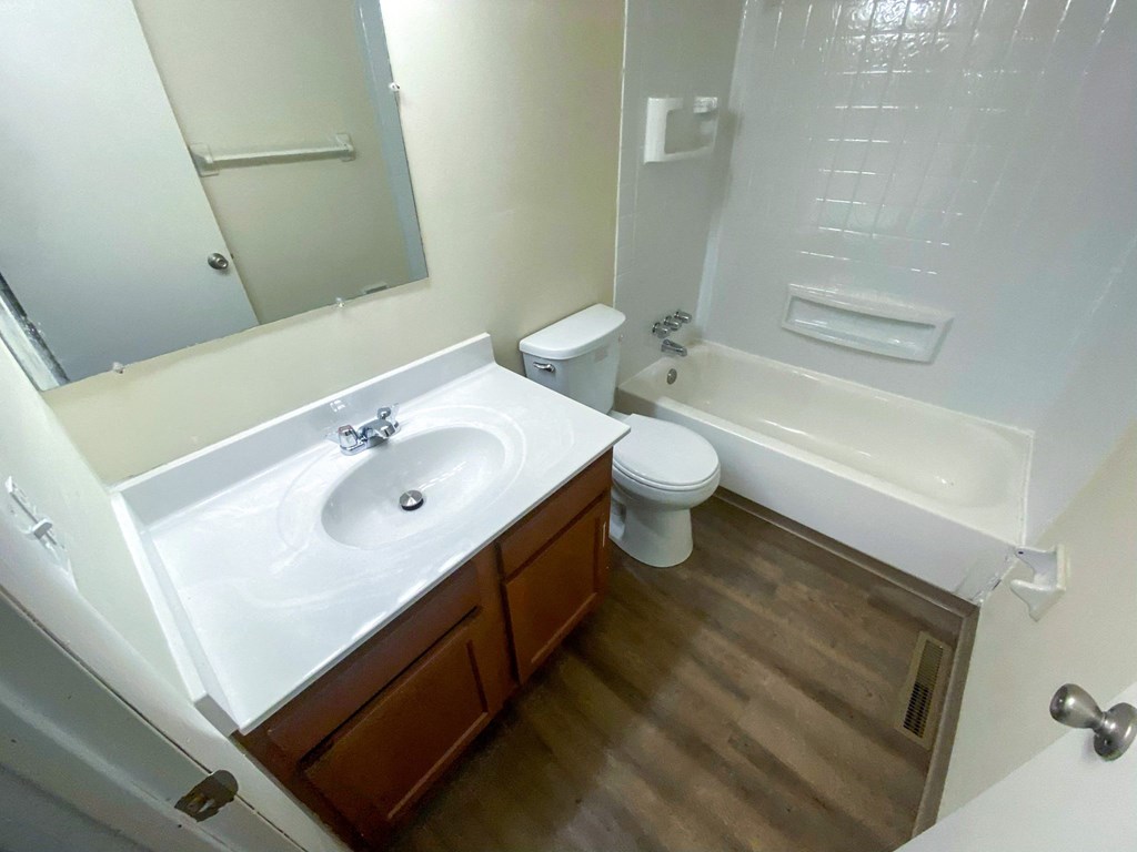 an empty bathroom with a sink and a toilet