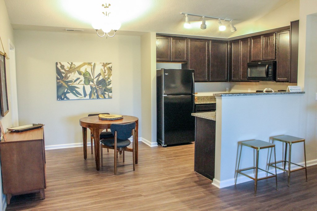 a kitchen and dining area in a 555 waverly unit