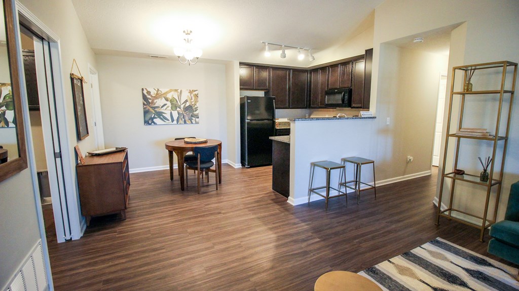 a view of the kitchen and living room from the dining area