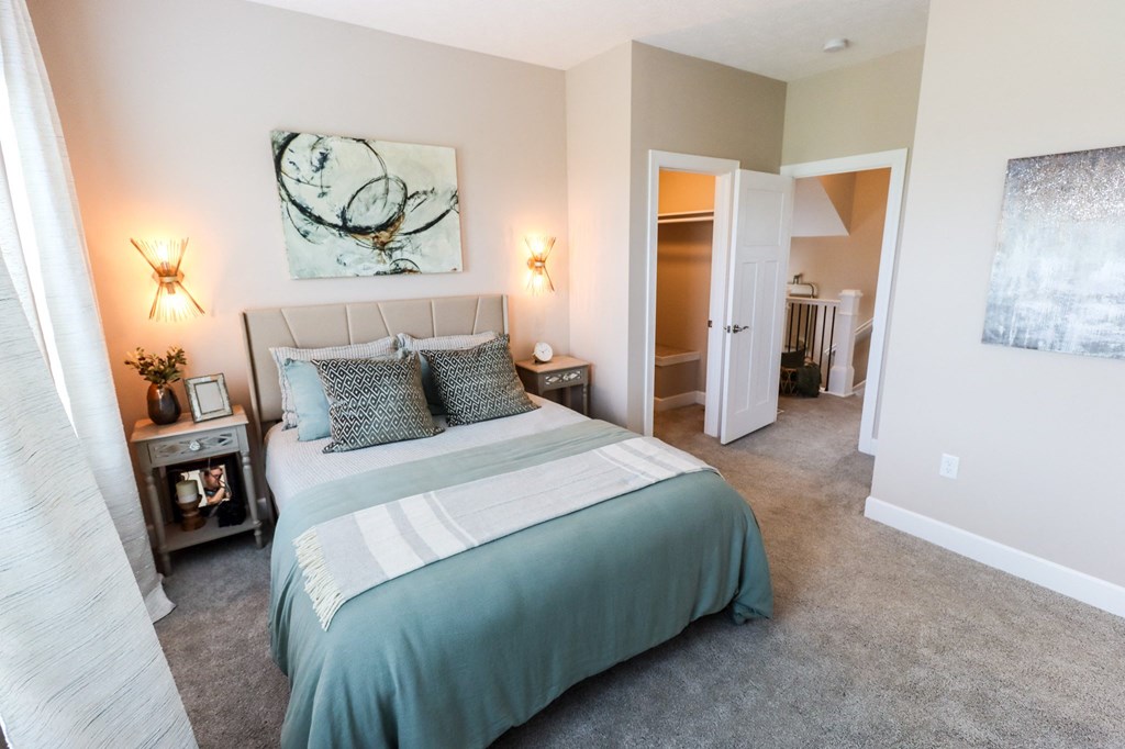 a bedroom with a bed and two night stands