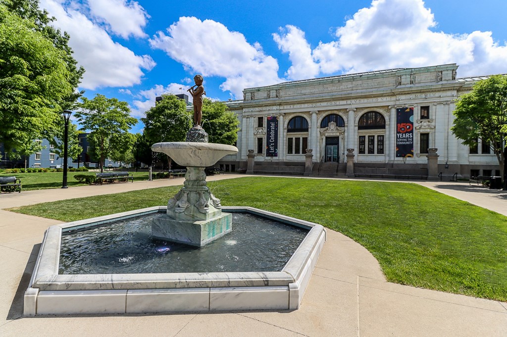a fountain in front of a building campus