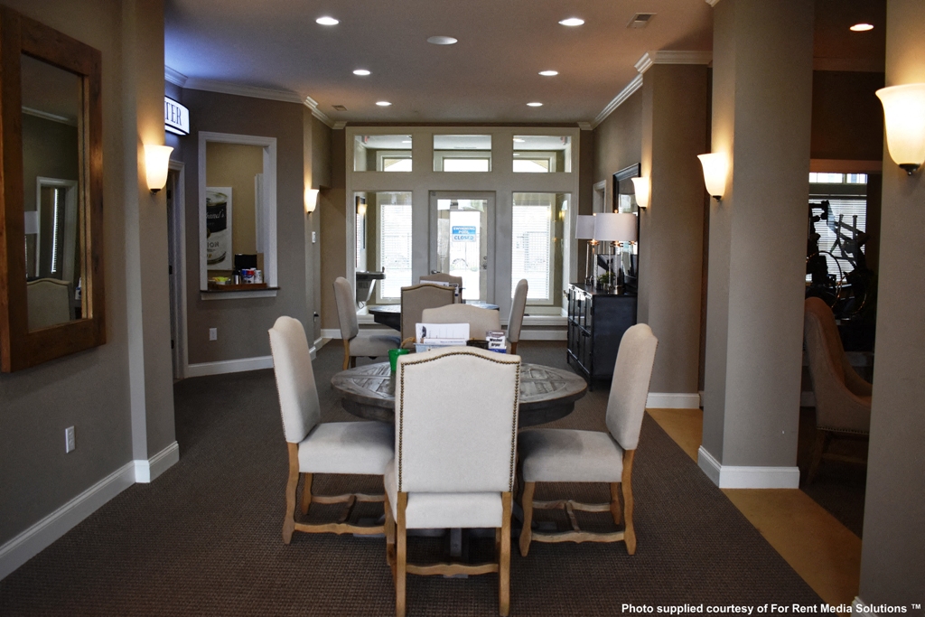 a dining room with a table and chairs