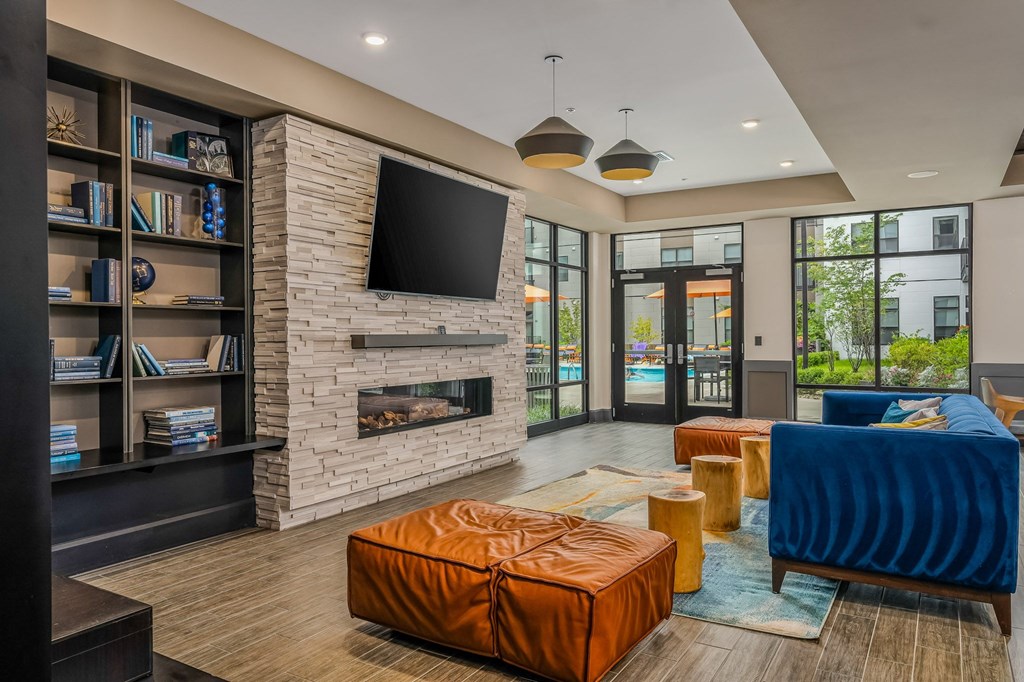 a living room with a fireplace and a television