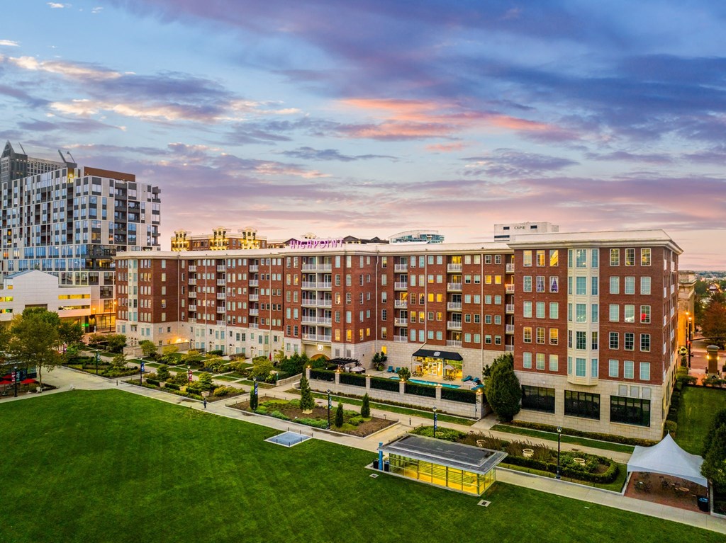 an aerial view of a large apartment building in the city