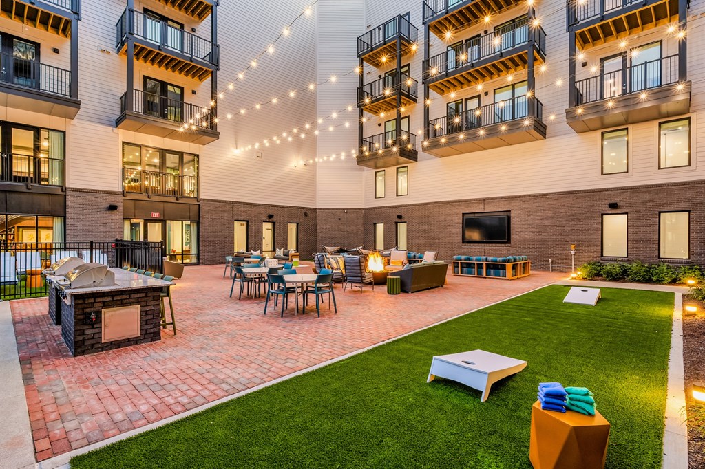 A patio area with a fireplace and seating area.