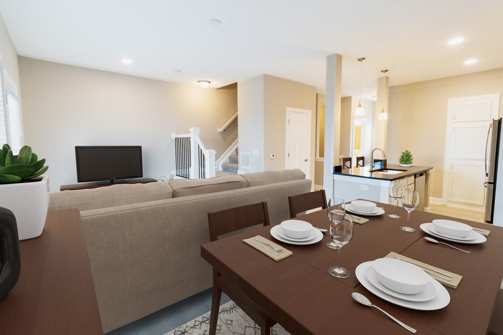 a living room and dining room with a table and a couch