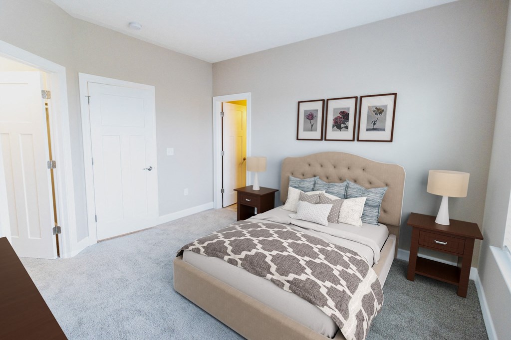 a bedroom with a bed and two night stands and a closet