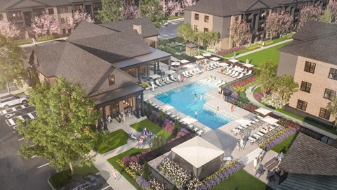A large outdoor swimming pool surrounded by lounge chairs and umbrellas.