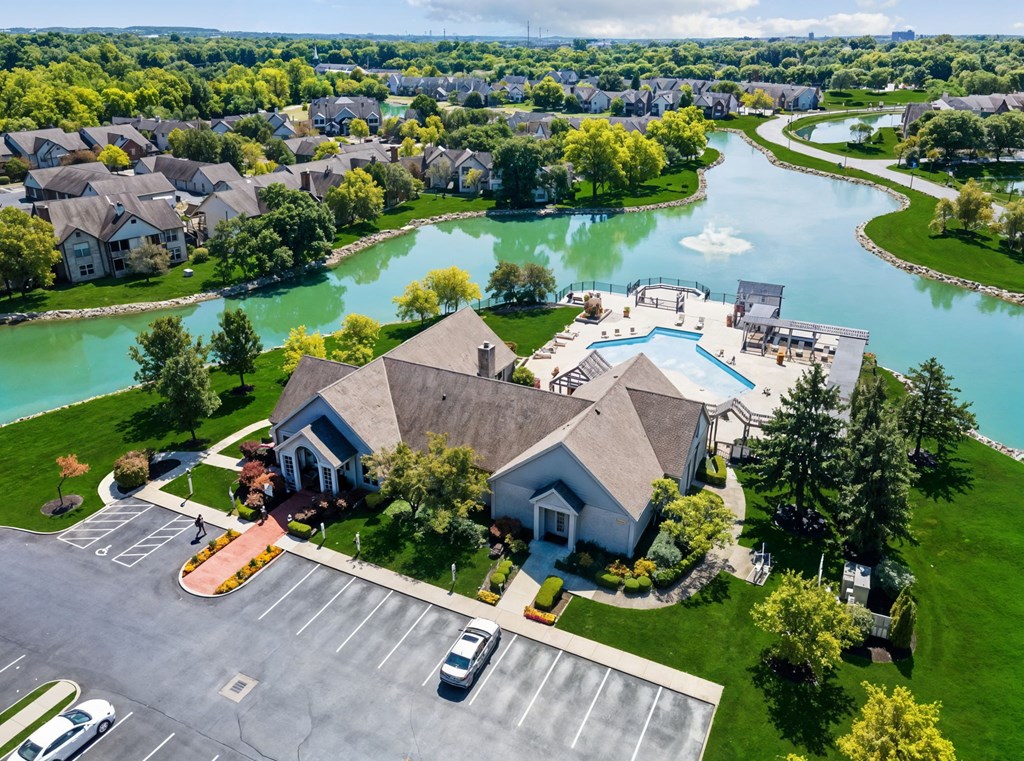 A large building with a parking lot in front of it.