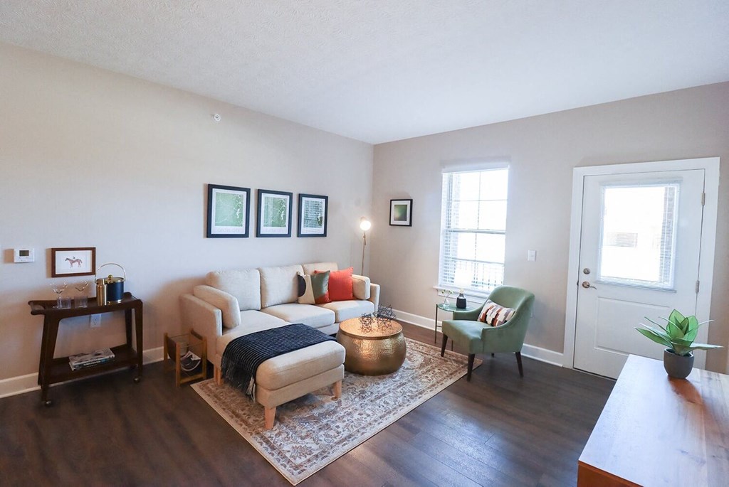 a living room with a couch and a chair