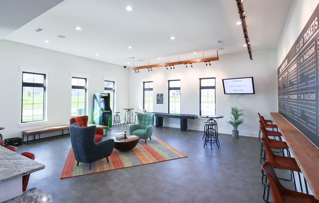 a large room with chairs and a table in the middle