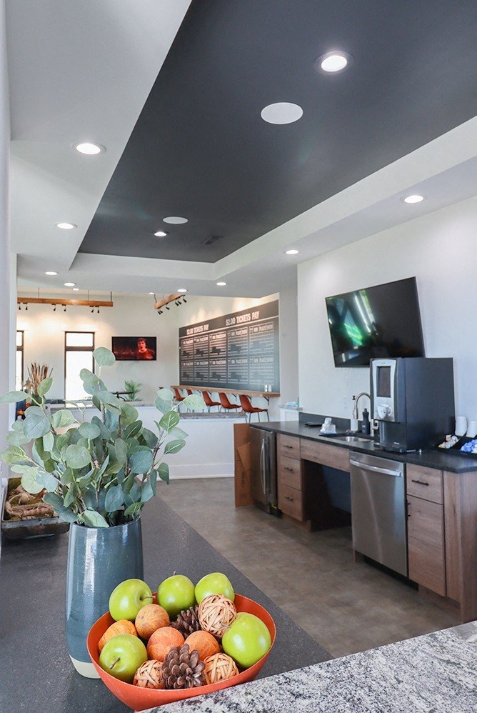 a bowl of fruit on a table in a kitchen