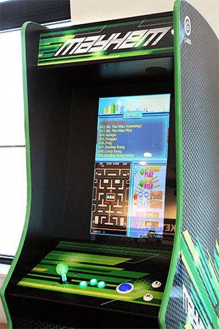 a green gaming machine with a game on it