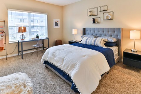 the preserve at ballantyne commons bedroom with large bed and windows