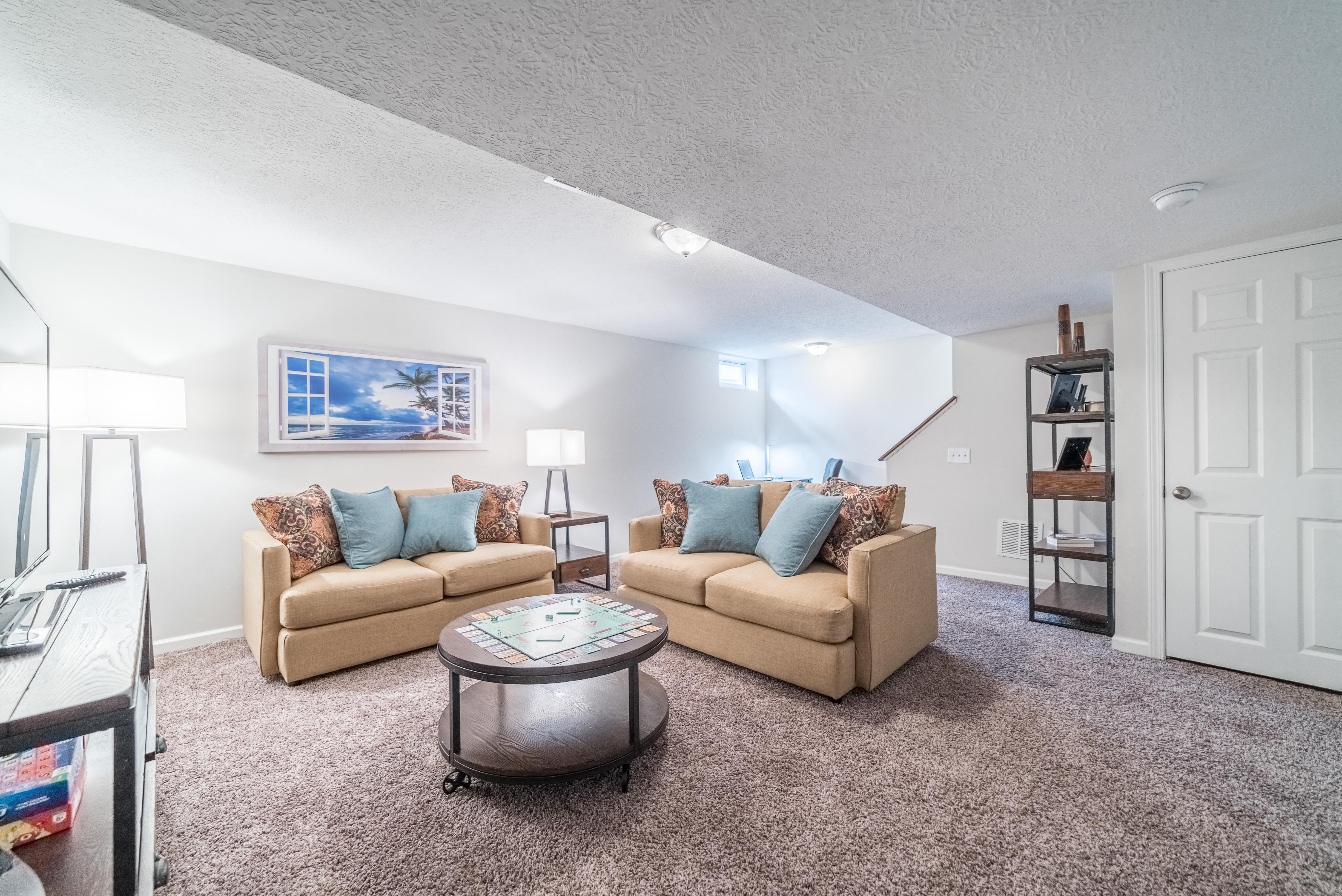a living room with couches and a table