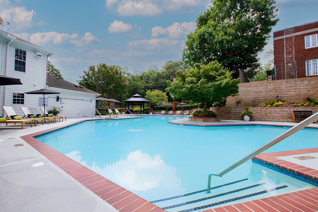 A swimming pool with a red and white striped edge.
