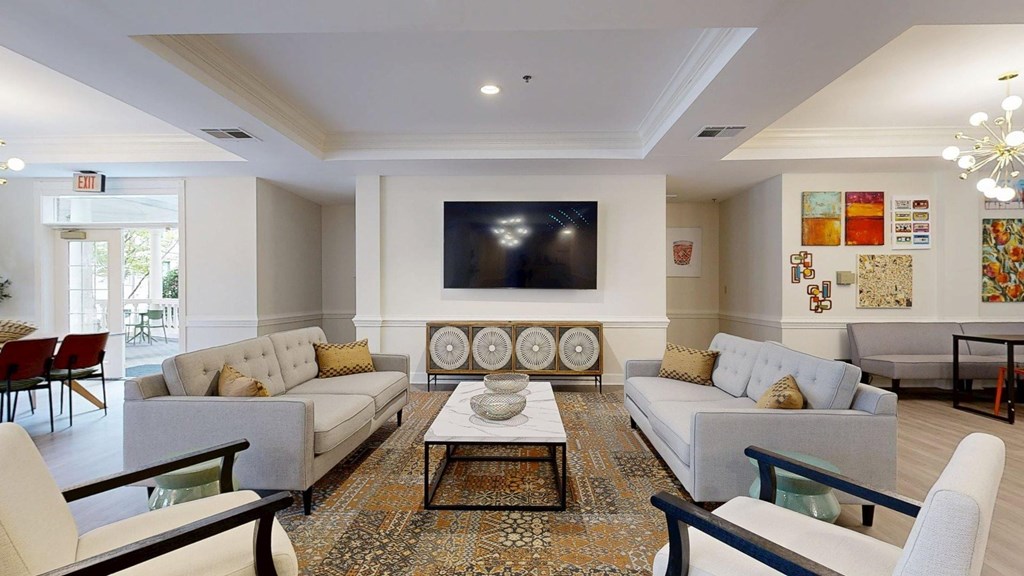 A living room with a grey sofa and a coffee table.