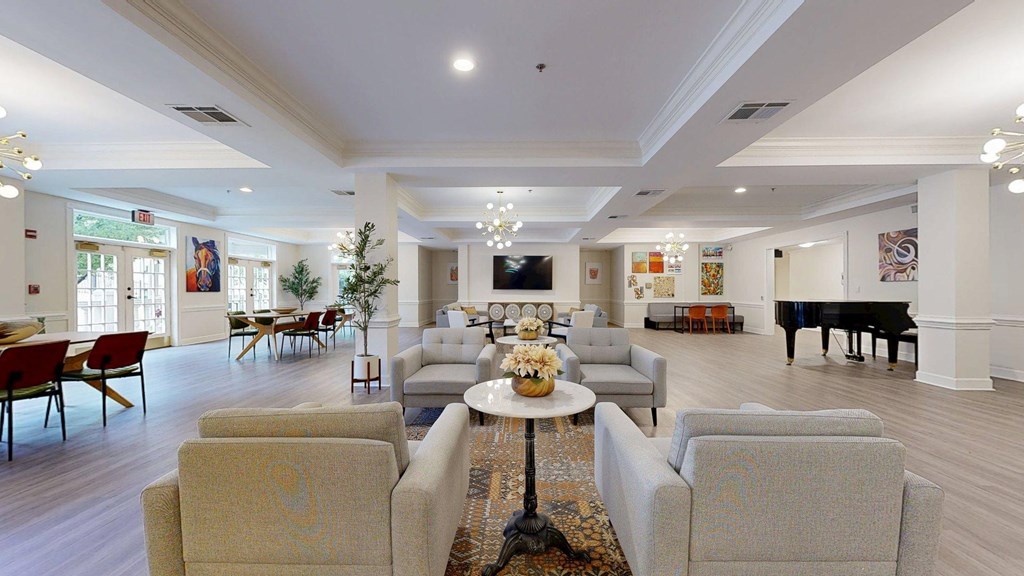 A living room with a piano and a couch.