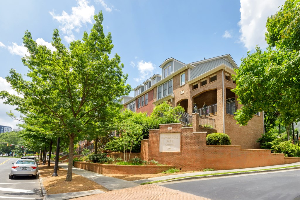 A building with a sign that reads "Ace" is surrounded by trees.