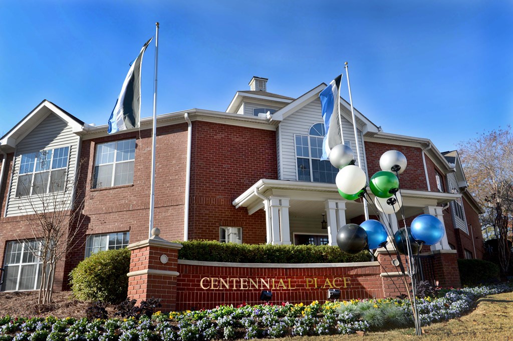 A building with a sign that says Centennial Place.
