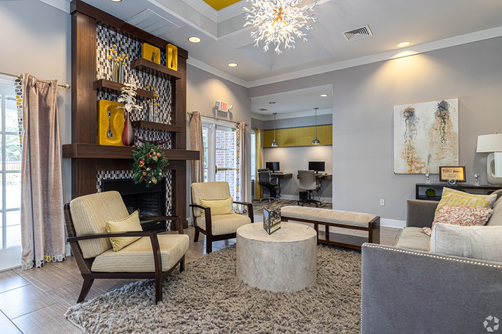 A living room with a fireplace and a chair.