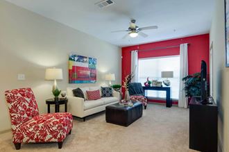 Carpeted living room with large windows at Ashley Auburn Pointe in Atlanta, GA - Photo Gallery 1
