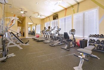 Room fully equiped with cardio and strength machines as well as free weights at Ashley Auburn Pointe in Atlanta, GA