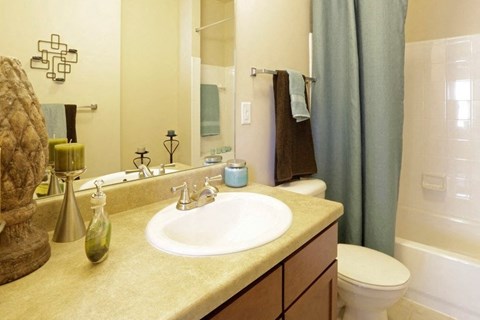 Tubs surrounded by ceramic tile at Ashley Collegetown in Atlanta, Georgia