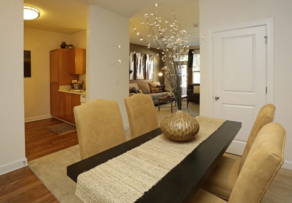 Dining room with beautiful wood floors at Capitol Gateway in Atlanta, Georgia