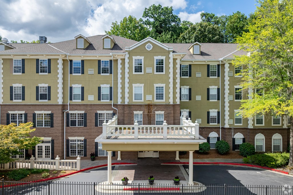 A large building with a white canopy in front.