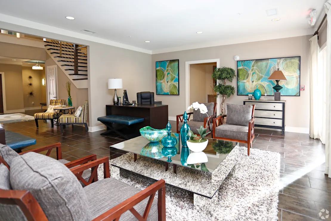 A living room with a grey couch and a coffee table.
