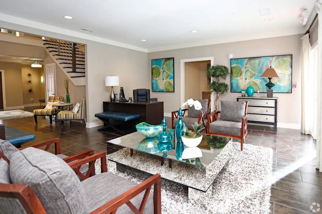 A living room with a grey couch and a coffee table.