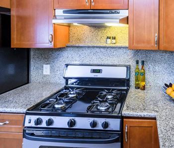 A black stove top oven with a digital display in the middle.