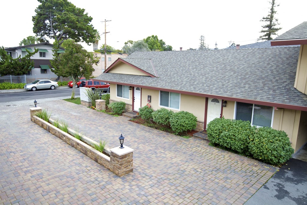 a view of the front of a house with a driveway