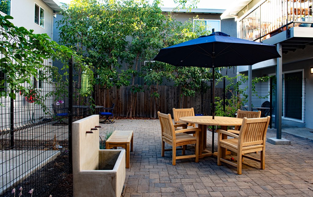 apartment courtyard with outdoor furniture to enjoy time with friends and family the outdoors