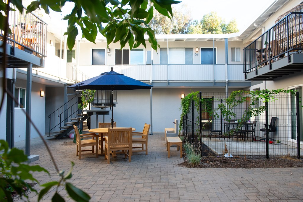 apartment courtyard with outdoor furniture to enjoy time with friends and family the outdoors