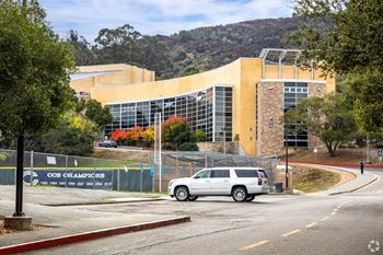 a white van parked in front of a building