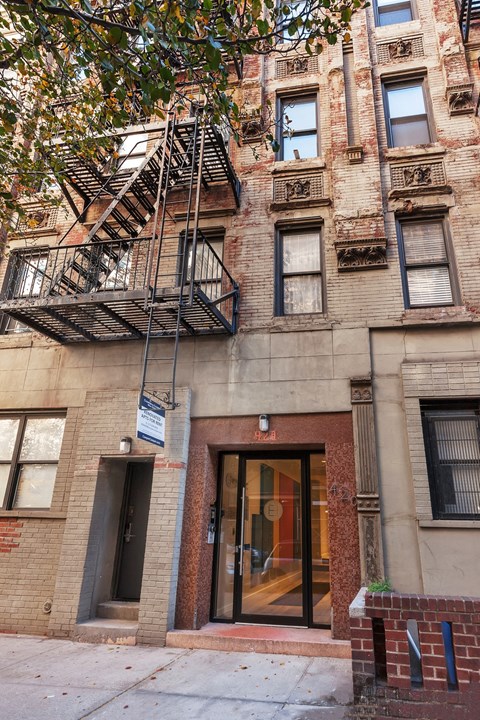 A building with a fire escape on the side.