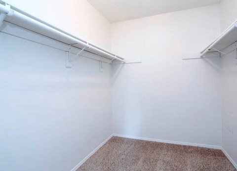 A room with white walls and a carpeted floor.