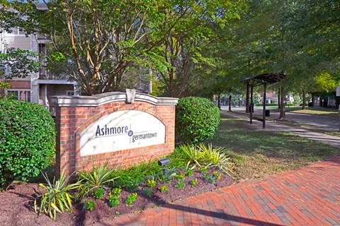 A sign that says Ashmore Germantown is in front of a building.