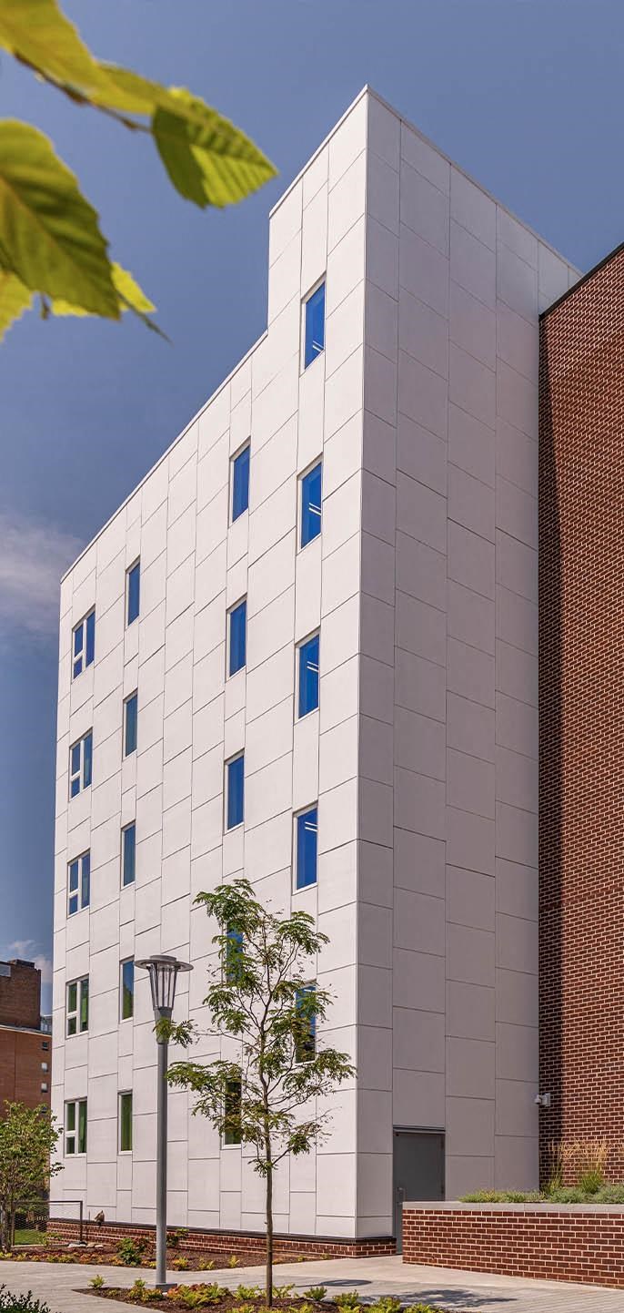a white building with blue windows on the side of it