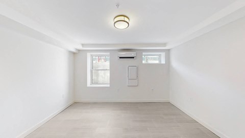 A white room with a window and a door.