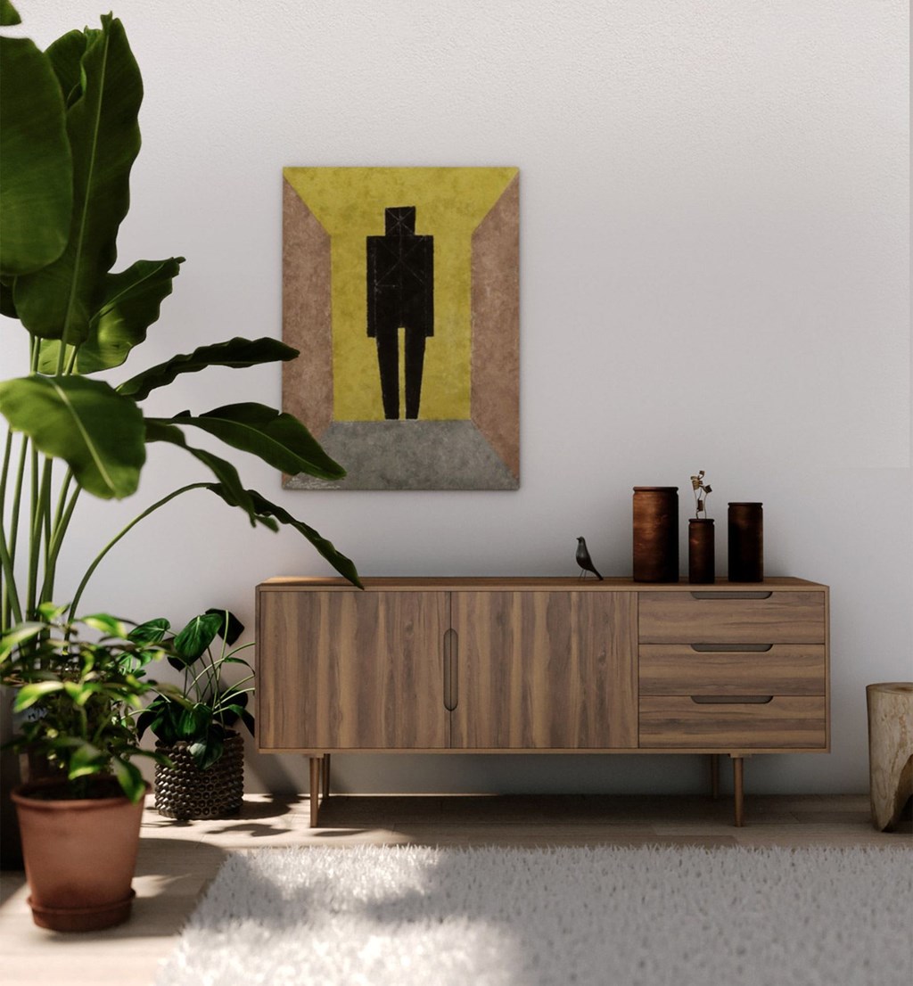 A painting of a person is hanging on a wall above a wooden cabinet.