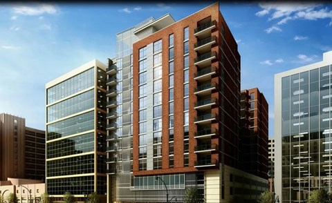Modern brick and glass apartment building exterior at The Premier Apartments, Silver Spring, MD