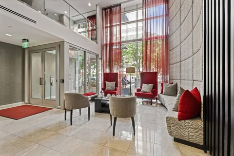 Modern lobby with seating and double height windows at The Premier Apartments, Silver Spring, 20910